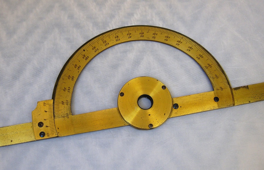 A large and cased English protractor with two long blades, circa 1820