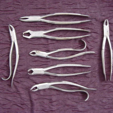 A 1800’s set of 7 dental forceps by J. Biddle, NY