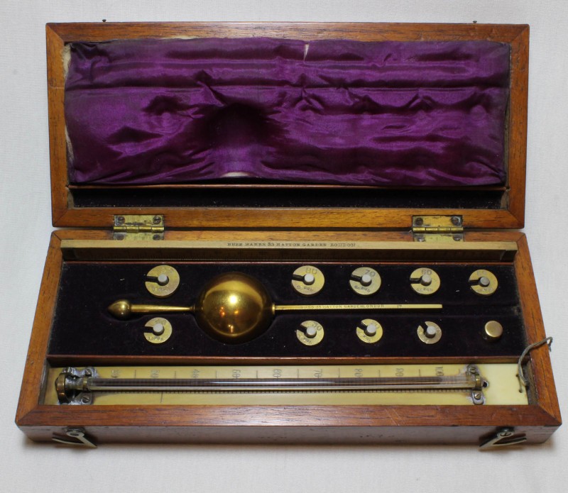 A LATE 19th CENTURY SIKES HYDROMETER COMPLETE WITH SLIDE RULE AND THERMOMETER IN ORIGINAL CASE