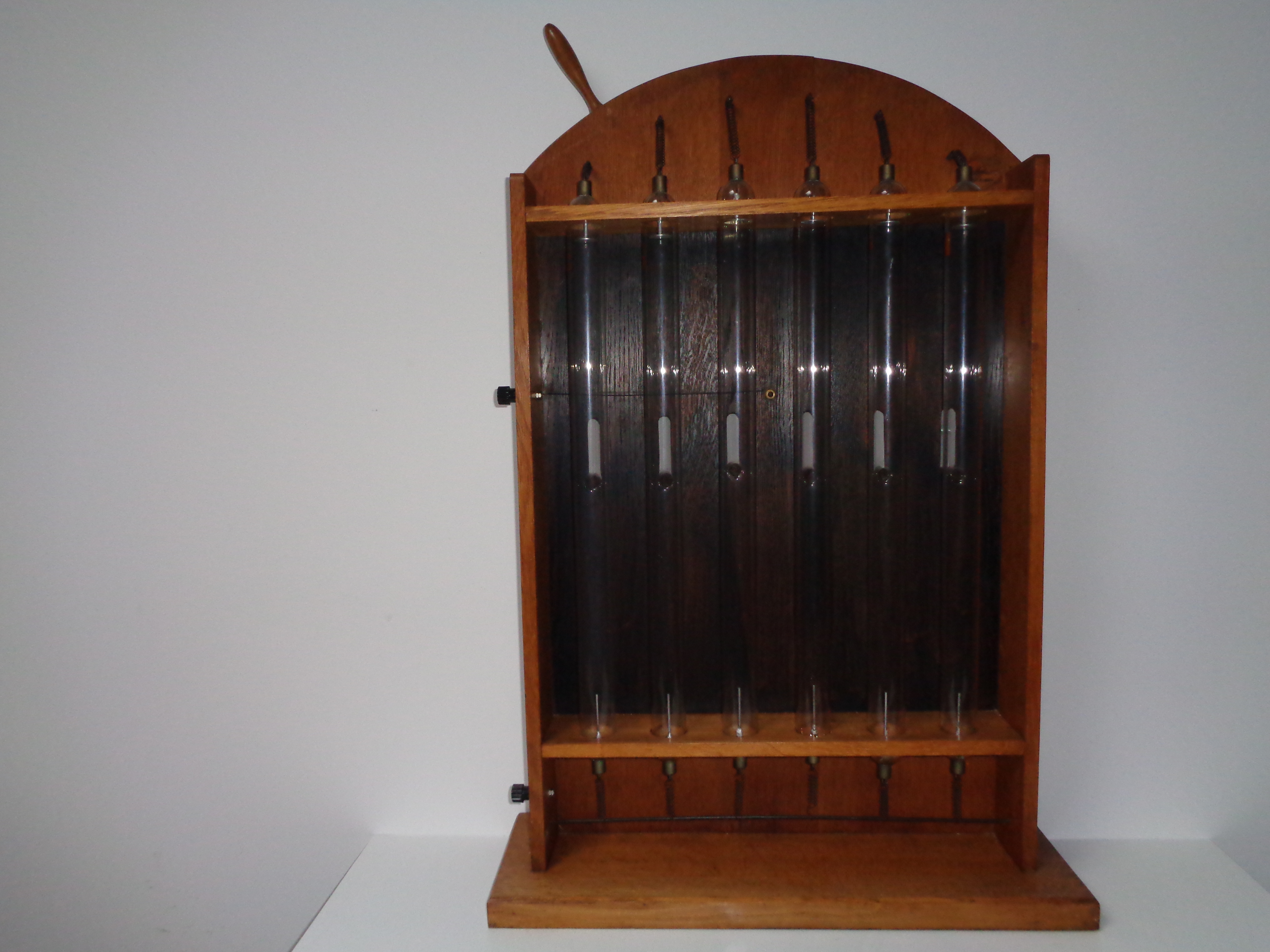 Geissler tube set in wood stand
