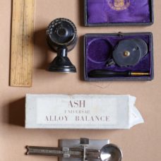 A Boxwood Sector, an Ash Universal Alloy Balance, a Model Eye and a Nettleship type Ophthalmoscope by Pillischer