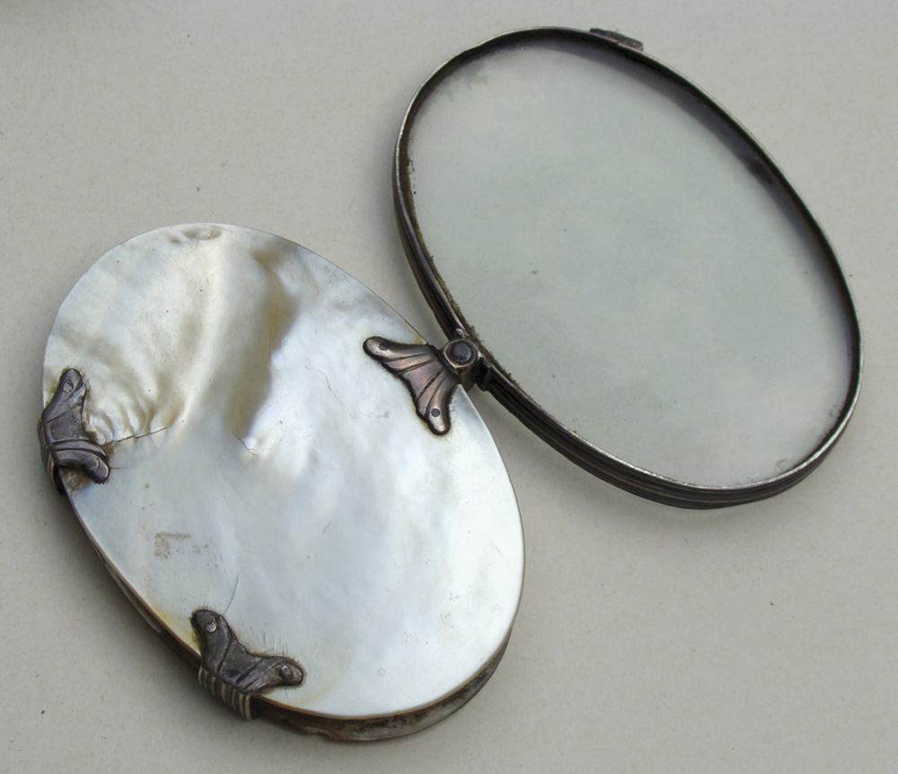 EXCEPTIONAL OVAL MAGNIFIER SET IN SILVER AND MOTHER-OF-PEARL