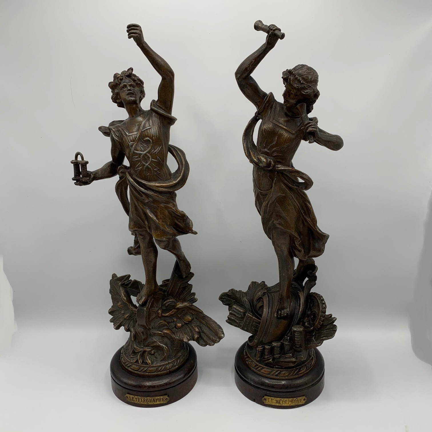 2 French statues, allegories of the telegraph and the telephone