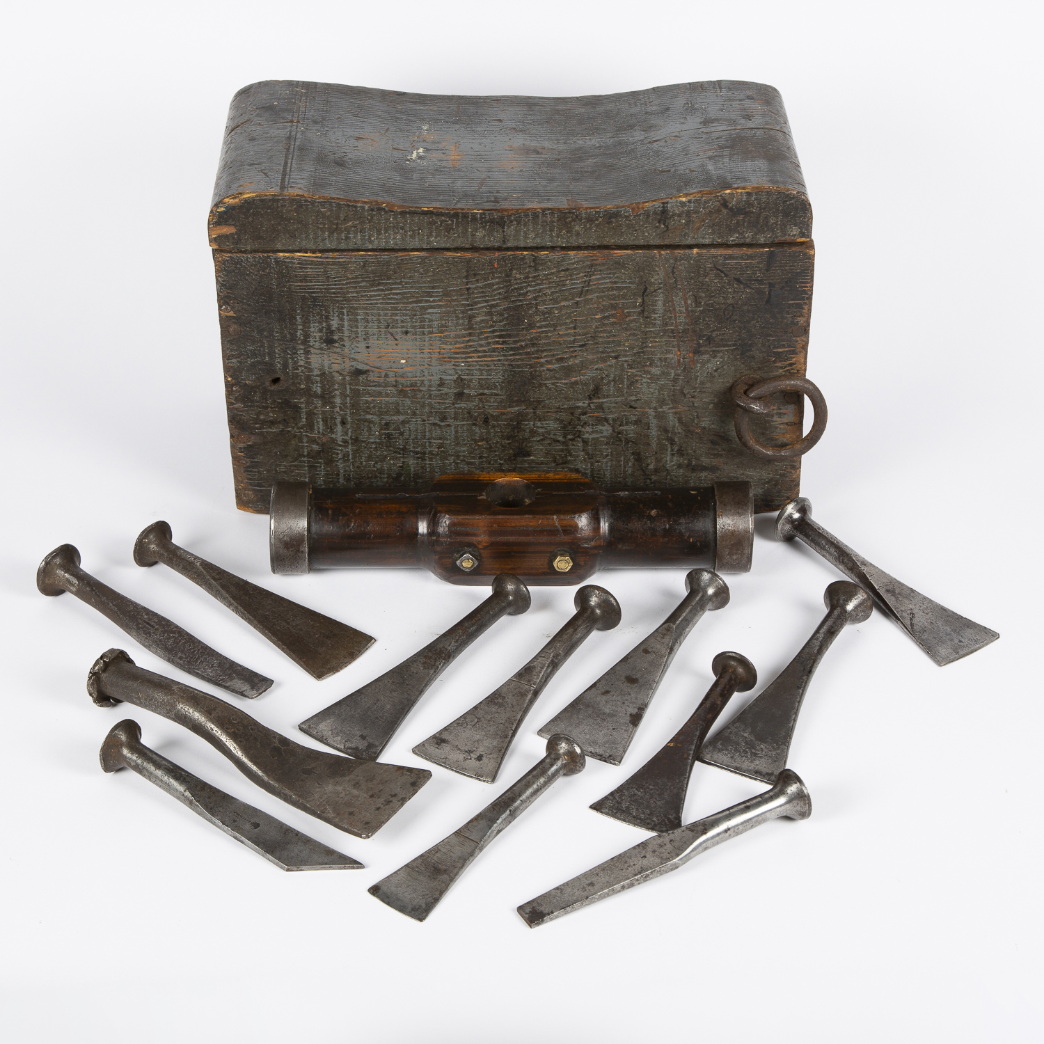 Shipwright’s calking seat, containing a mallet head and 12 steel caulking irons.