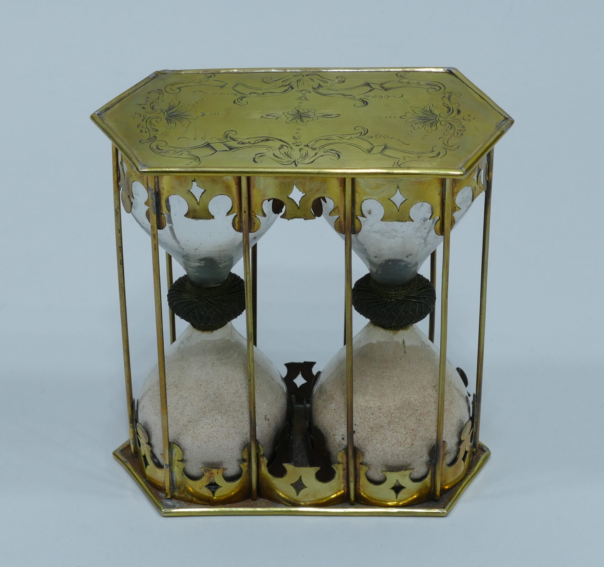 17th century double brass hourglass with flower decors