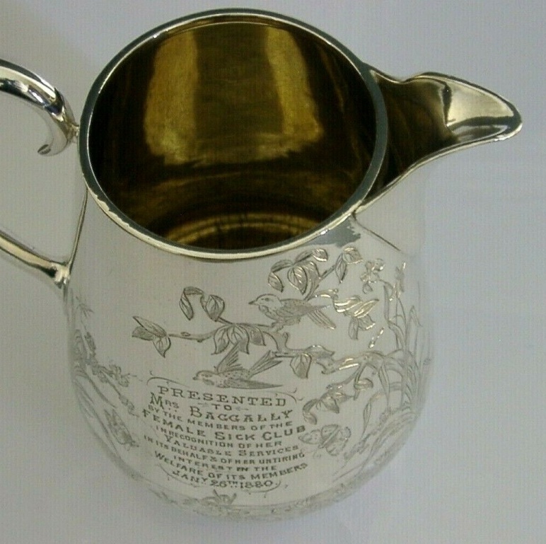 A silver-plated jug  presented to a member of a “Female Sick Club” in 1880