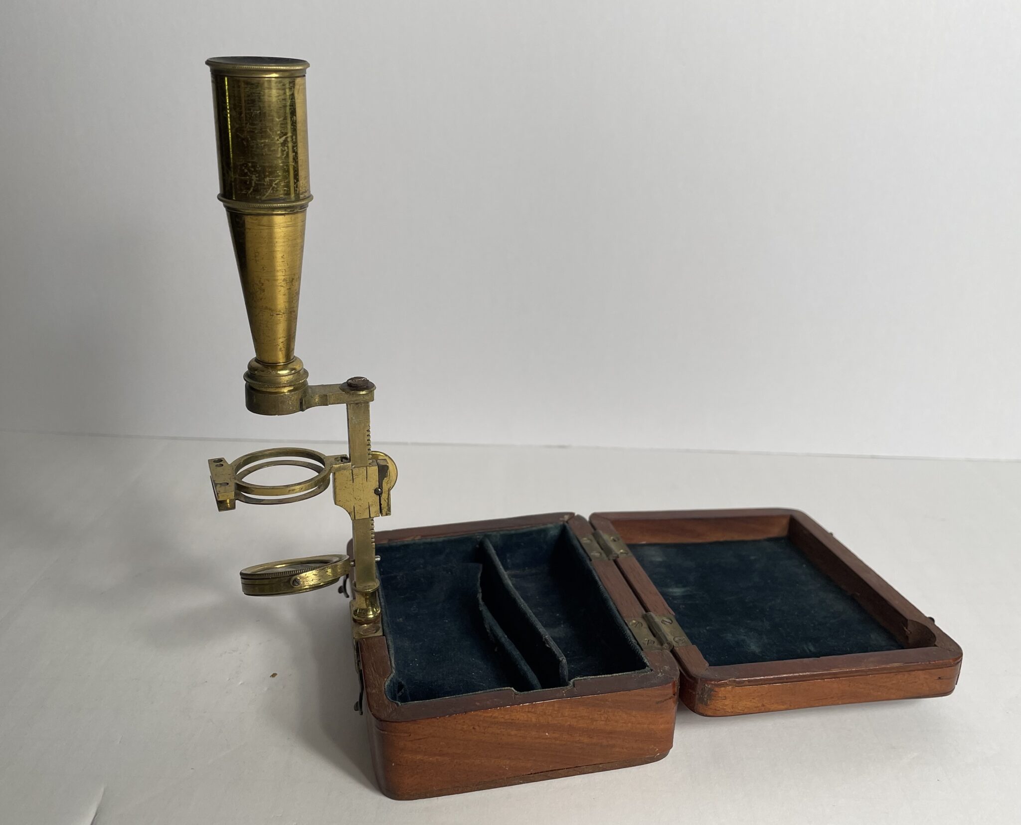 Cary signed Gould type case mounted microscope.