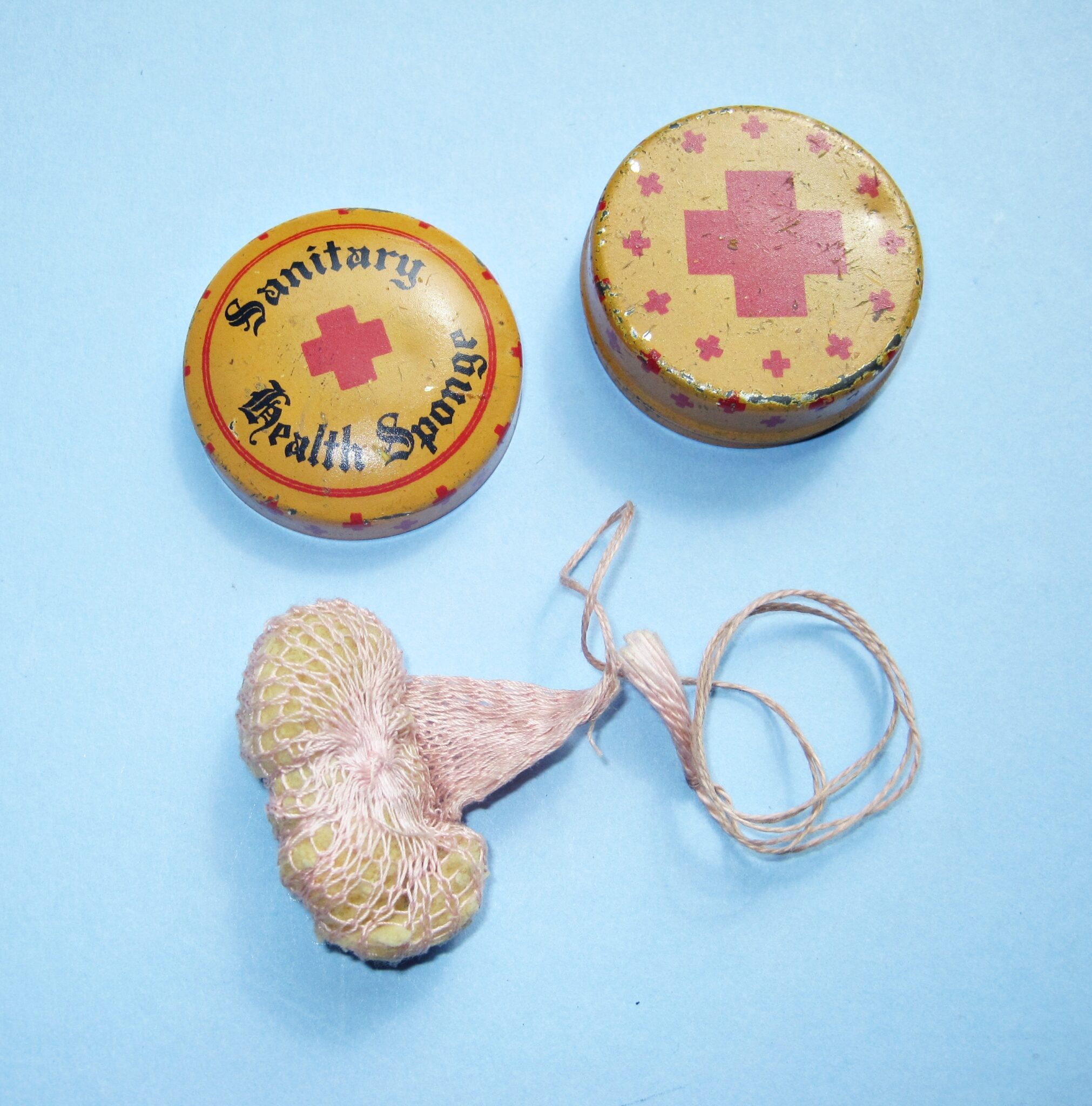 A c1920s contraceptive sponge in its orginal tin