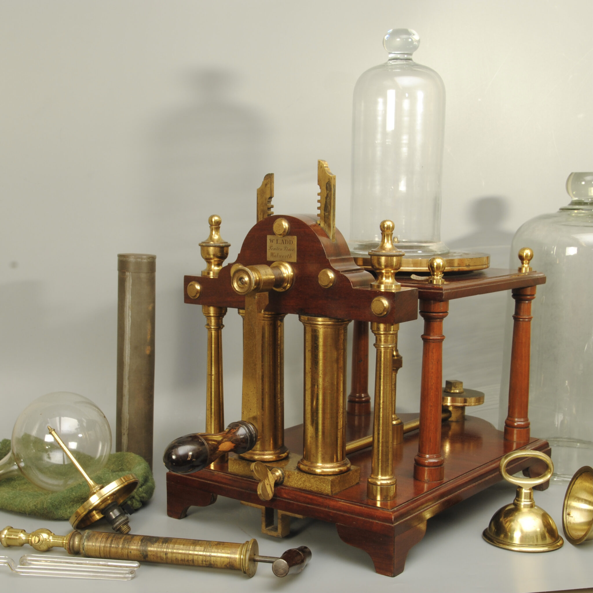 Superb example of a brass and mahogany vacuum pump