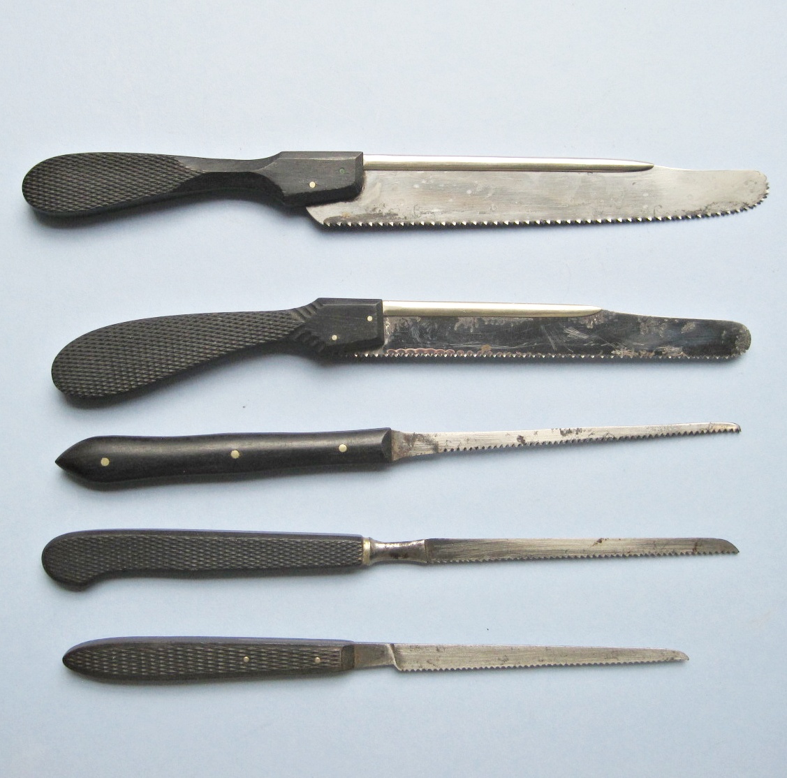 FIVE 19TH-CENTURY METACARPAL SAWS: ALL WITH EBONY HANDLES