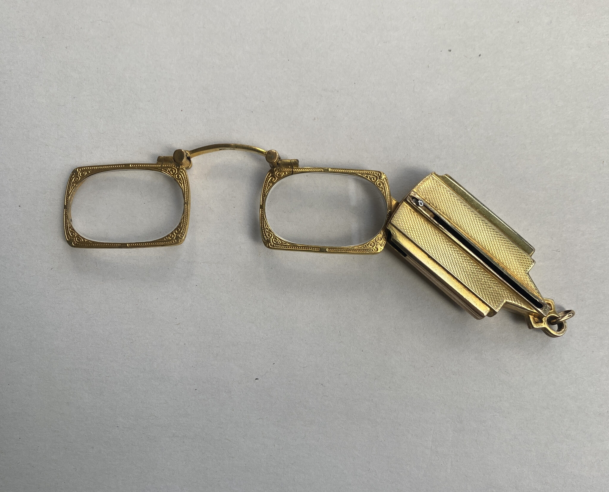 Unusual gold-plated collapsing lorgnettes.