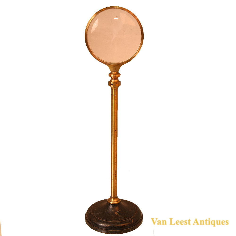 Lacquered brass magnifying glass on stand