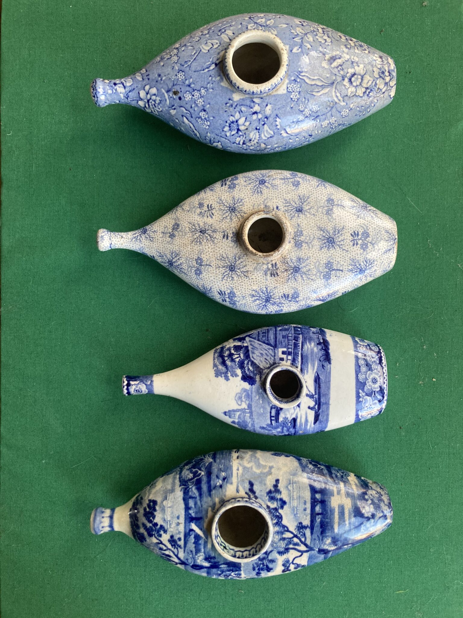 Four Submarine Type Ceramic Baby Feeders
