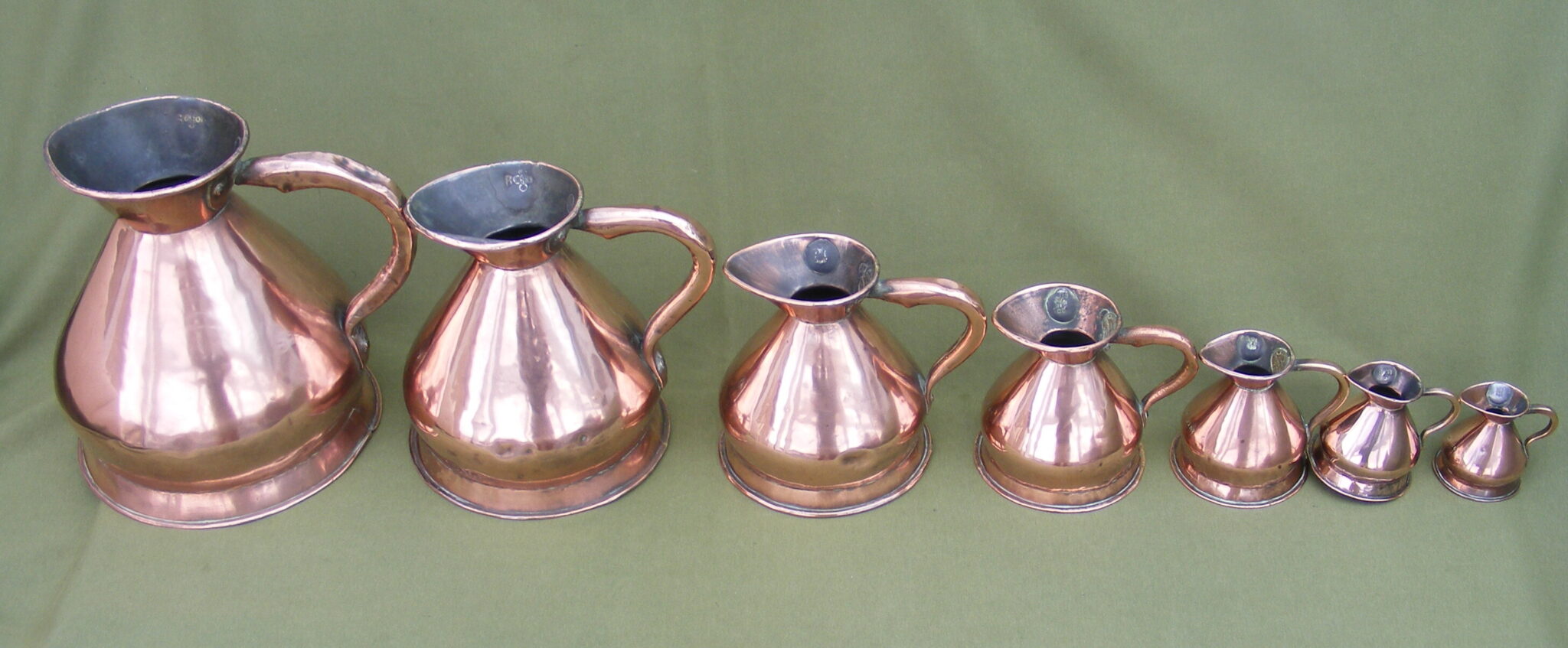 ANTIQUE SET OF SEVEN COPPER MEASURES