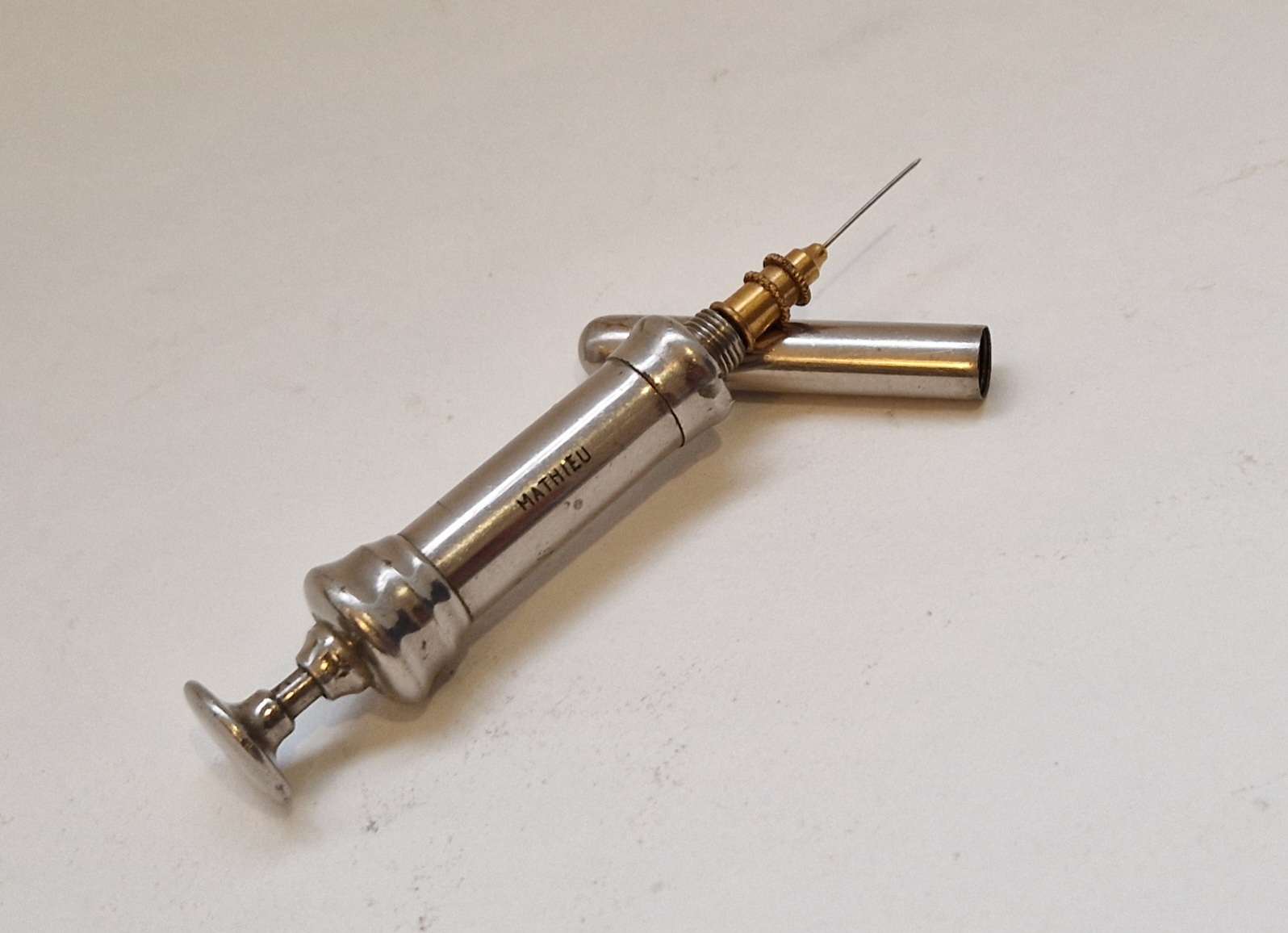 Very unusual and pocket hypodermic syringe in plain metal by Mathieu, circa 1860