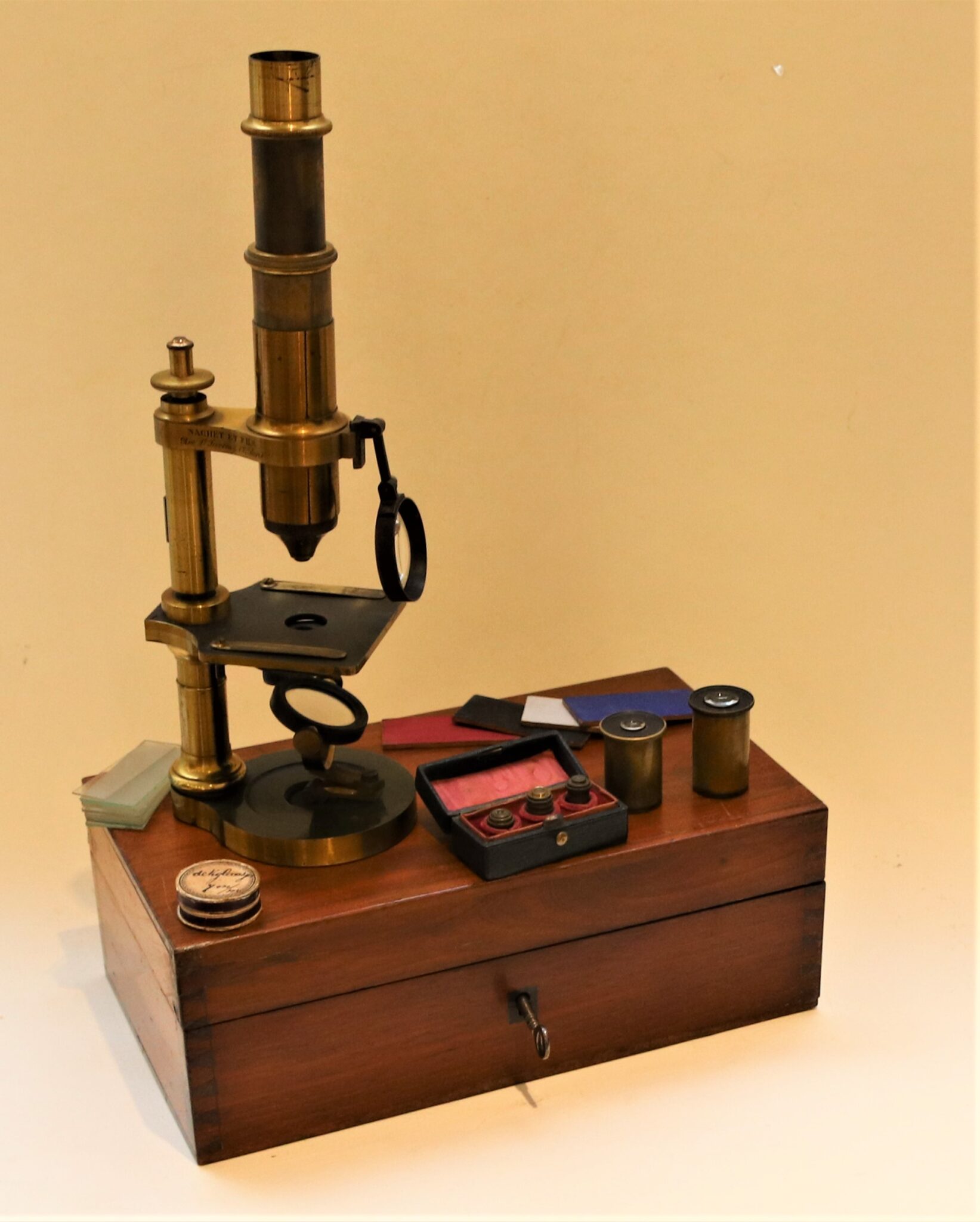 An early round foot Nachet microscope, c. 1865