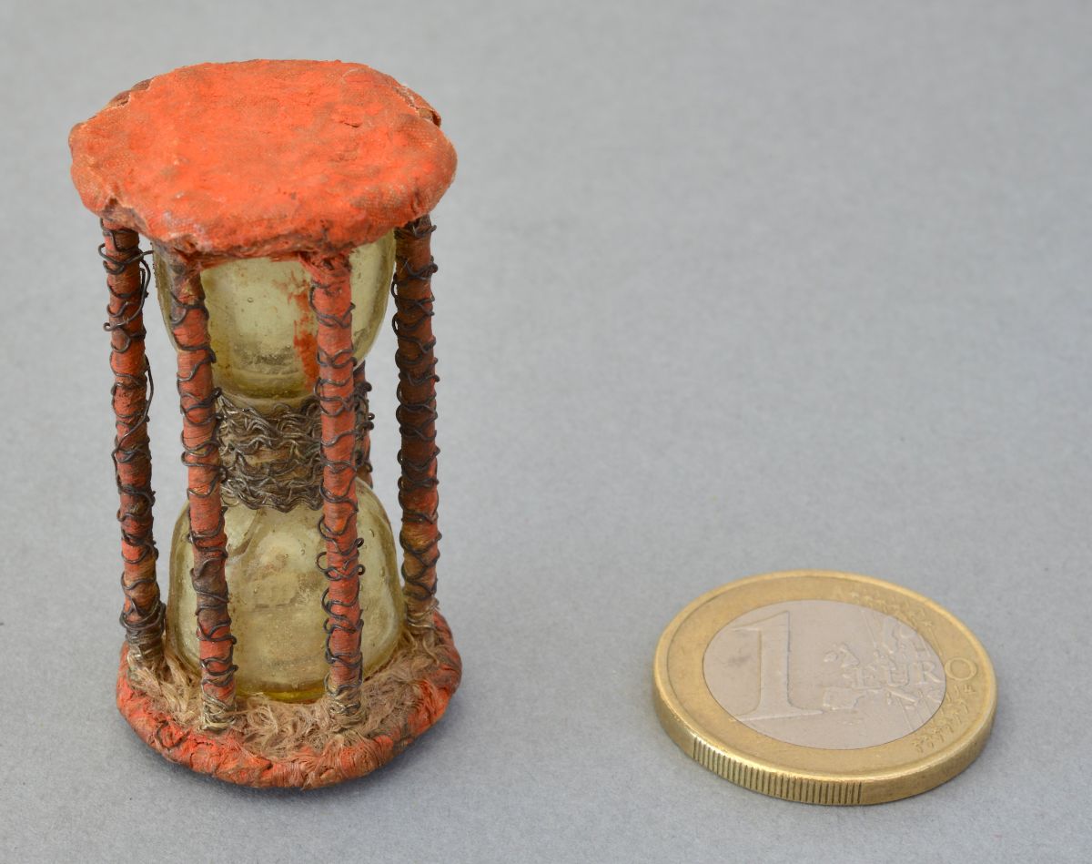Miniature red cardboard hourglass made in Italy circa 1650