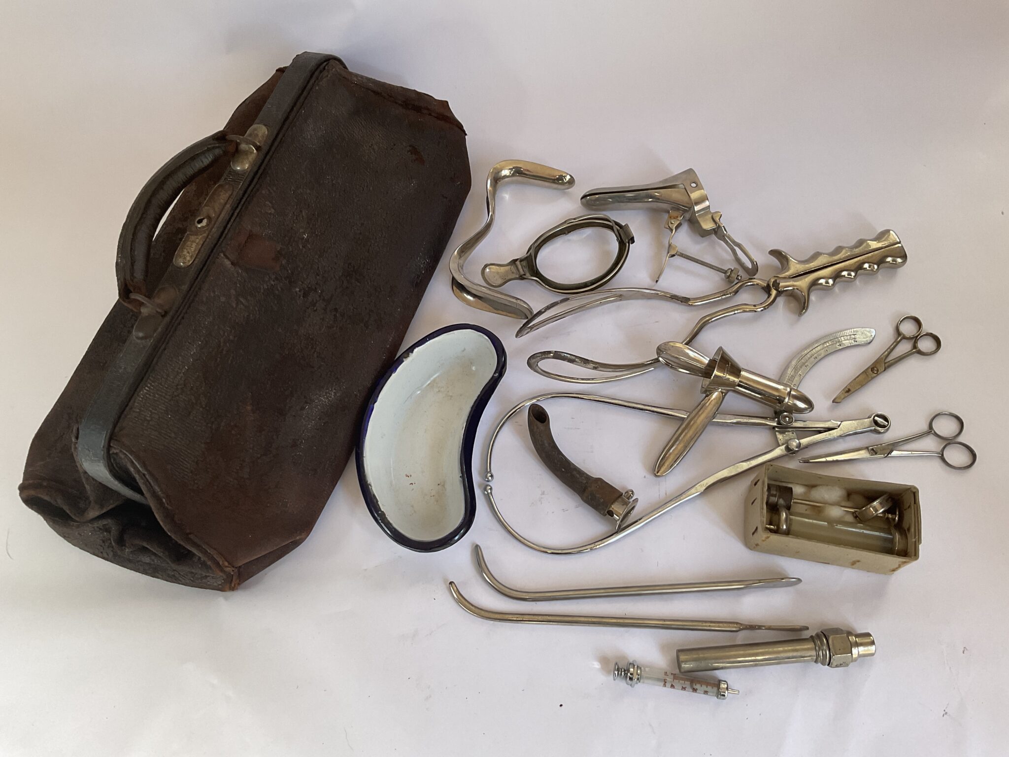 Antique Gladstone bag and instruments