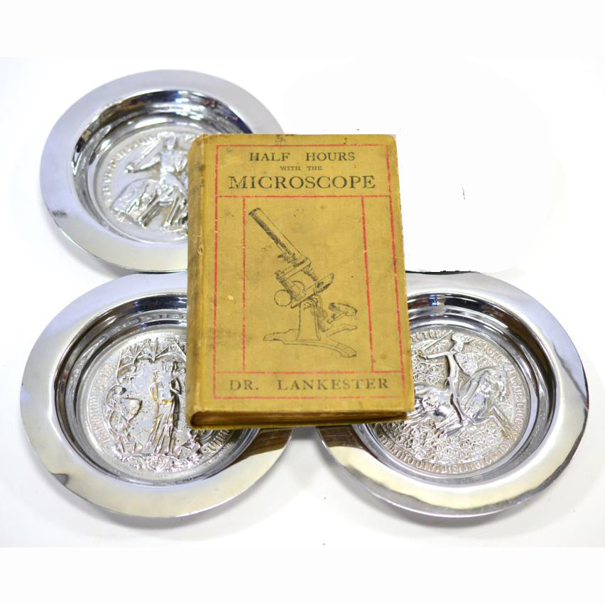 Three ashtrays chromed by Sir Edward Elgar (1857-1934) together with microscopy book: Half-Hours with the Microscope by Dr. Lankester;
