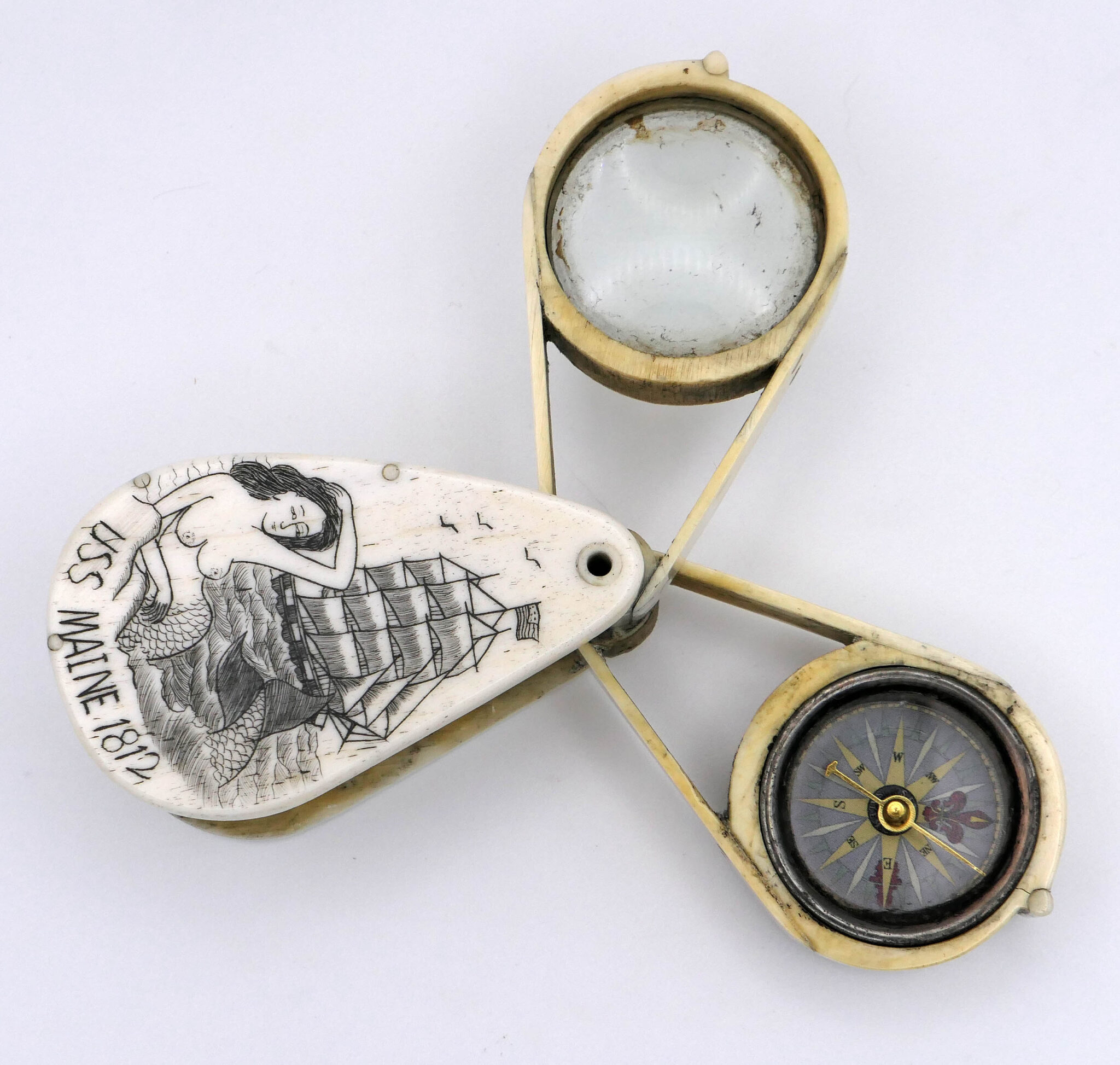 scrimshaw bone compass and magnifying glass, marine