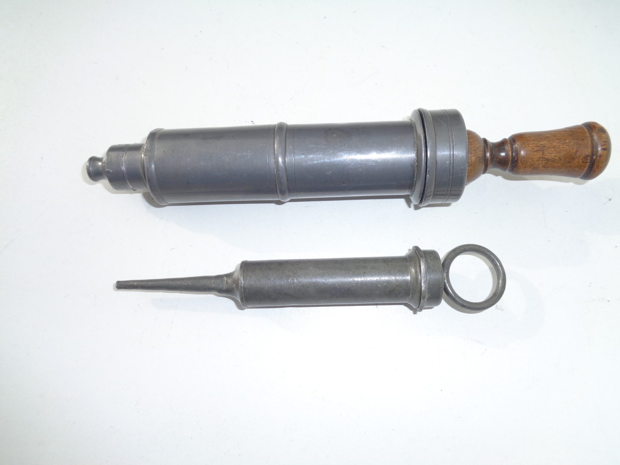 Two small pewter  syringes, 19th century