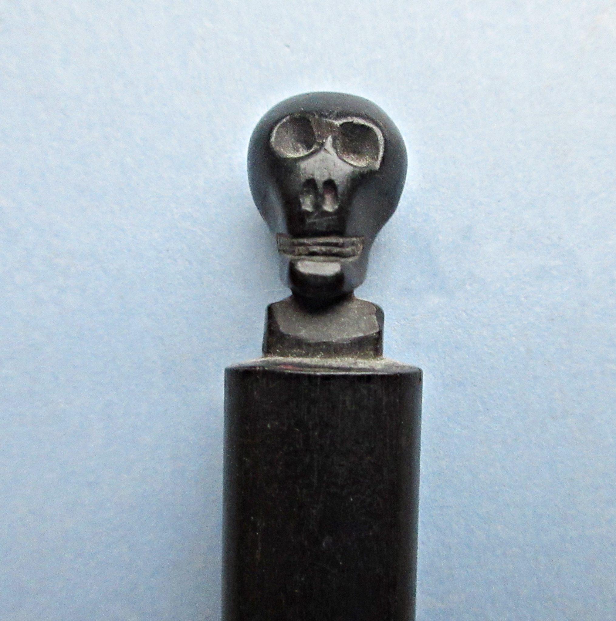 A Macabre Ink Eraser (AKA: Rubber) with Skull Finial