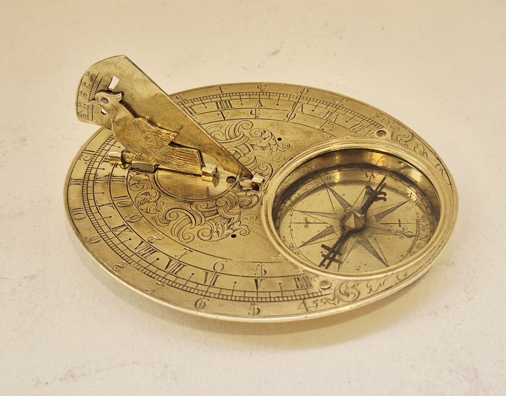 A gilded brass oval horizontal sundial attributable to Culpeper, circa 1700