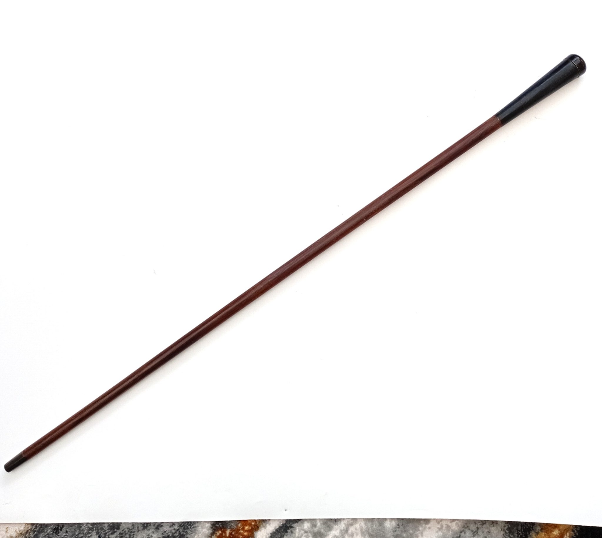 Walking stick with concealed telescope.