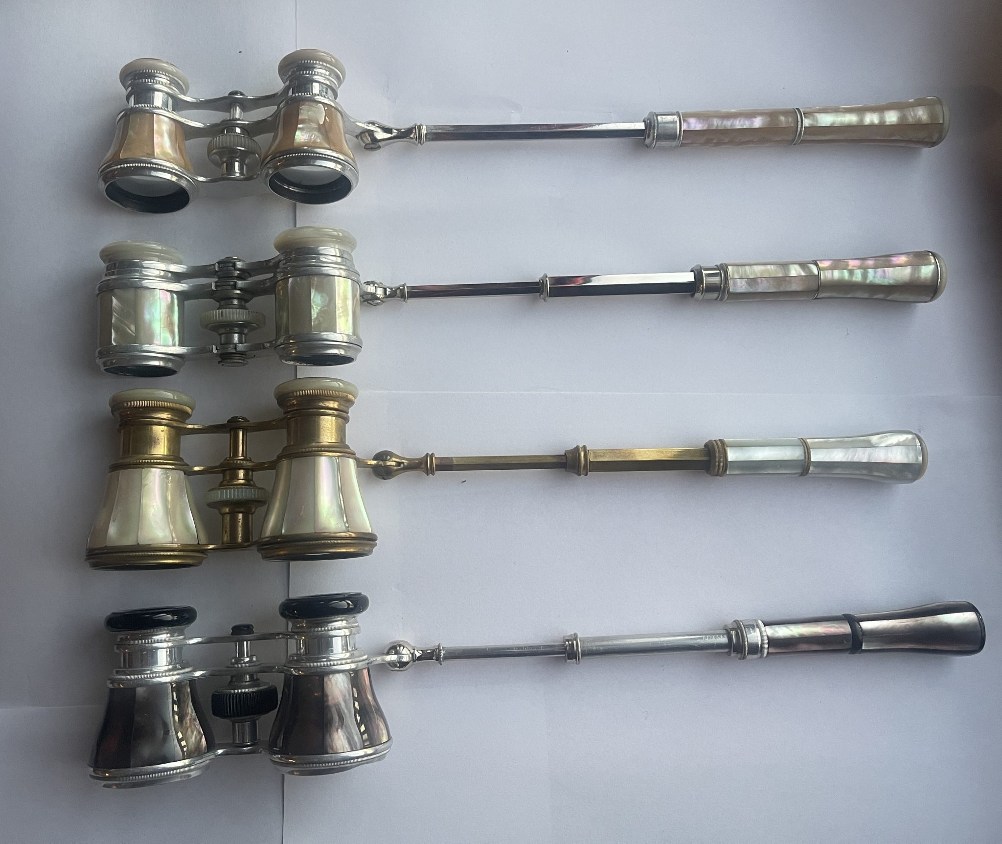 Various pairs of 1900’s Mother of Pearl & Metal Opera Glasses. All with extending arms.